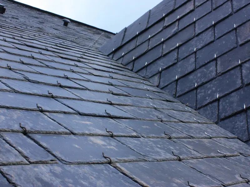 Natural slate roof meeting at a lead-lined valley