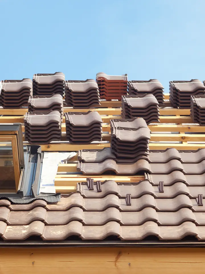 New roof tiles going on around a roof window