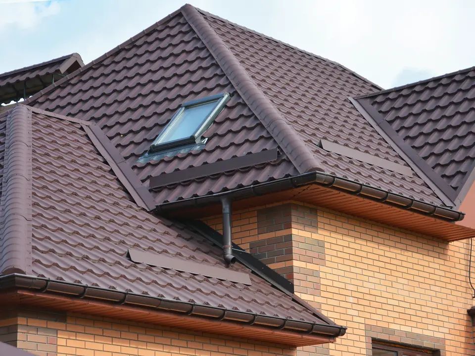 Finished tiled roof with roof windows and new guttering
